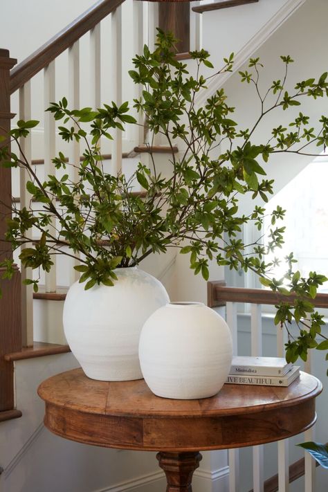 The Konos Vase is a round bellied cement vase in bright textural white. Its size and shape provide a perfect canvas for a large statement arrangement or a simple tropical stem. Weight: 17.8 lbs Dimensions: 14.50" x 14.50" x 14" Material: Concrete PLEASE NOTE: this item may drop ship from the vendor & have a longer transit time (7-10 days). if ordered as an in-store pick up, the same delay (7-10 days) may occur depending on inventory & availability. Styling With Vases, Large Round Vase Flower Arrangements, Floral Arrangements For Bathroom, Flowers Arrangements For Home, Statement Arrangement, White Round Vase, Round Foyer, White Vase Decor, White Sofa Living Room