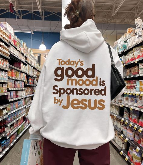 Today's Good Mood Is Sponsored By Jesus Hoodie, Religious Hoodie, Positive Christian Shirt, Jesus Sweater, Bible Verse Hoodie, Catholic Gift WELCOME TO THE COSY STREET FASHION 🚩If you're in search of soft, comfortable, high-quality clothes, you've come to the right place!  We sell trendy and customized sweatshirts, shirts and hoodies also cool gifts for your loved ones. If you have any questions, concerns, or comments about our products, feel free to send us a message anytime 🚩If you want to change or add anything to the design shown in the display picture, please contact the seller through the message box to confirm if the changes can be made 🗨️ SIZE & COLOR -Please check size and color chart before order -Our apparels are unisex 🗨️ OUR PRODUCT -Printed in USA -Products will be made D Hoodies That Hoodie, Jesus Sweaters, Christian Sweatshirt Designs, Casual Outfits For School, Customized Sweatshirts, Shirts To Make, Jesus Hoodies, Jesus Sweater, Christian Gift Ideas