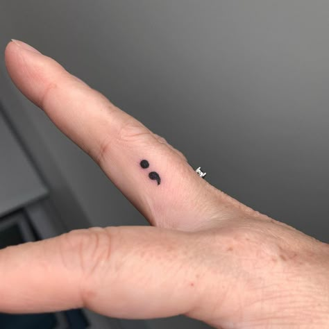 Hand Tattoos Semicolon, Small Finger Tattoos Semicolon, Comma Tattoo Semicolon, White Ink Tattoo Semicolon, Small Tattoo Ideas Semi Colon, Stick And Poke Tattoo Ideas Semicolon, Semi-colon Tattoo Ideas Finger, Semicolon Tattoos For Women, Semicolon Finger Tattoo