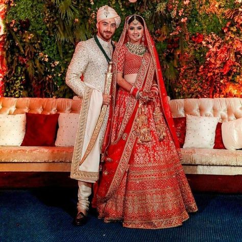 Groom Indian Wedding Outfits With Red Lehenga, Red Lehenga Bride And Groom, Indian Bride Groom Outfits, Bride Groom Poses Indian Wedding, Bride And Groom Indian Wedding Outfit Red, Red Sherwani Indian Groom, Groom Sherwani Indian Latest, Latest Sherwani Designs For Groom, Bride And Groom Indian Wedding Outfit