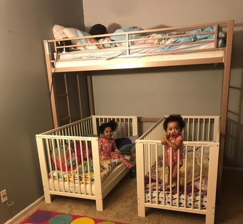 Needless to say we have a lot of kids (5 in total) so we are always trying to save space wherever we can. My husband and I recently decided to merge all the girls together in one room so we needed a way to fit all the beds in there. We purchased a metal loft bunk bed from Walmart, which sits up higher than a normal bunk bed. We then went to IKEA and bought two convertible cribs for our little ladies. The cribs fit perfectly underneath and still have a walk way for the two year old to get out. Bunk Beds With Crib Under, 3 Cribs In One Room Ideas, Loft Bed Crib Underneath, Crib And Bunkbed Shared Room, Bunk Beds And Crib Shared Room, Crib Under Loft Bed, Crib Under Bunk Bed, Two Under Two Bedroom, Loft Bed With Crib Underneath