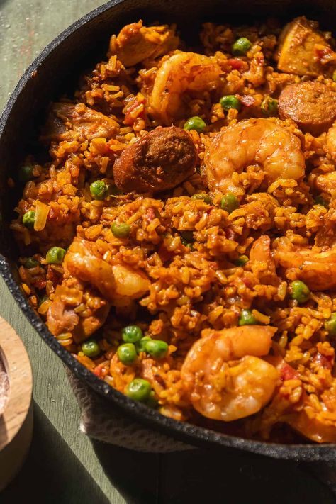 Make dinner easy with this homemade brown rice paella recipe! It's loaded with high quality protein from chicken, shrimp, and chorizo, savory veggies and spices, and made with fluffy saffron brown rice for a healthier twist on the classic paella. Paella With Chicken, Brown Rice Recipes Healthy, Shrimp And Chorizo, Chorizo Rice, Vegetarian Paella, Healthy Rice Recipes, Chicken Chorizo, Beef Brisket Recipes, Healthy Rice