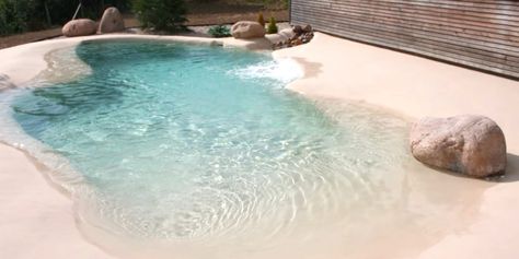 Instead of installing traditional pools for some backyard fun in the sun, people are creating their own sandy beaches! Sand Pool Ideas, Beach Entrance Pool Designs, Sand Pools Backyard, Small Beach Pools Backyard, Backyard Beach Pool, Pool Beach Ideas, Faux Beach Backyard, Small Beach Entry Pool, Sand Pool Backyard