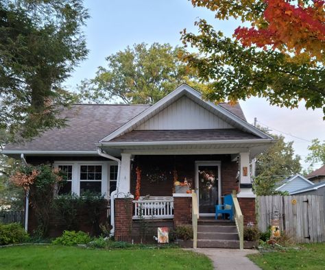 Red brick house with small front porch