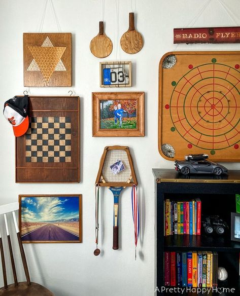 vintage game gallery wall small updates in the kids' bedrooms Vintage Game Wall, Gallery Wall Lake House, Vintage Game Boards Decor, Vintage Game Decor, Vintage Basement Decor, Game Room Gallery Wall, 70s Game Room, Vintage Game Room Decor, Vintage Basement Ideas