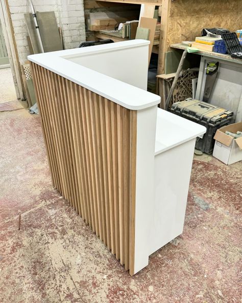 Reception desk, Solid oak slats 🤍 Wood Slat Front Desk, Small Front Desk Ideas, Salon Suite Reception Area, Reception Desks Office, Reception Desk Makeover, Small Front Desk Ideas Reception Areas, Salon Break Room Ideas Small Spaces, Small Reception Desk Design Modern, Salon Break Room Ideas