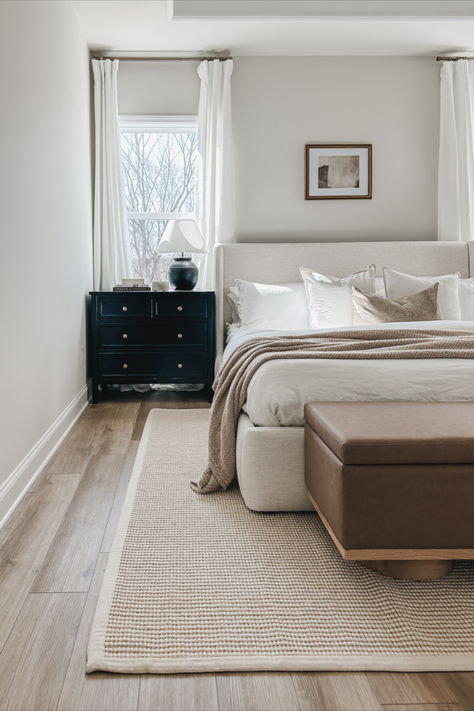 Light and bright primary bedroom styled with a jute/wool rug to add texture, a vegan leather storage bench and baby dressers used as nightstands. Shop the look, Amazon bedding, rugs USA, same finds, bedroom style, spring style, Walmart finds, Amazon finds, wayfair furniture, upholstered bed, curtain details Amazon Bedroom Furniture, Upholstered Bed Bedroom, Baby Dressers, Light Airy Bedroom, Light And Airy Bedroom, Amazon Bedding, Leather Storage Bench, Airy Bedroom, Simple Bedroom Decor