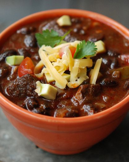 I love making this pork chili on lazy Sunday afternoons. Serve it with limes, chiles, hot sauce, sour cream, avocado, cheddar, corn chips and warm flour tortillas. #recipe Chili Recipe With Black Beans, Pork Chili, Dried Black Beans, Andrew Zimmern, Black Bean Chili, Magazine Recipes, Bean Chili, Dark Beer, Mexican Foods