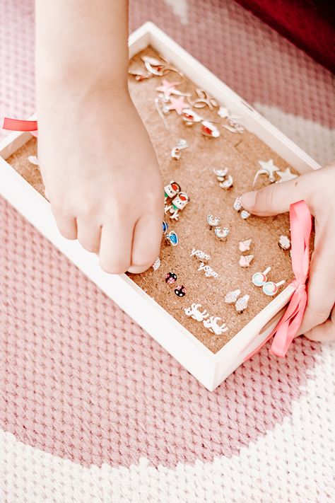 An easy tutorial for making a DIY earring holder to display all your stud earrings. This tutorial is inexpensive and uses a dollar store product to create a pretty jewelry box. Make one for yourself and a child or friend. You can get creative and decorate these earring holder boxes any way you like. #DIYEarringHolder #earringholder #easy #studearrings #diy #dollarStore #display