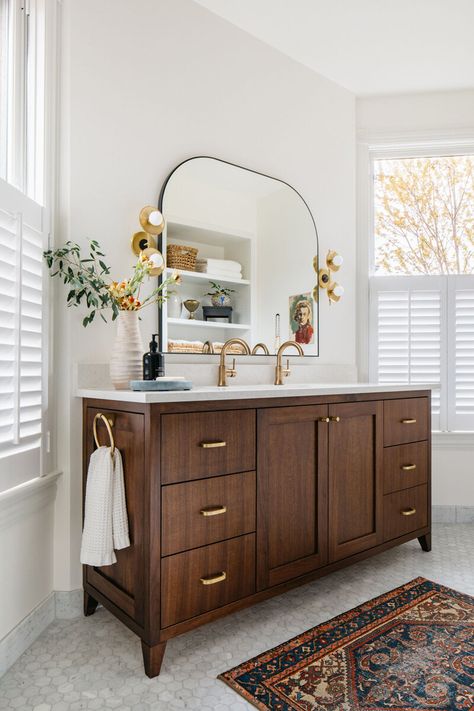 Bathroom Brass Fixtures Interior Design, Bathroom Vintage Rug, Bathroom With Persian Rug, Wood Vanity Brass Hardware, Bathroom With Black And Brass Fixtures, Good Fixtures Bathroom, Brown Wood Bathroom Vanity, Boho Bathroom With Black Cabinets, Black Mirror In Bathroom