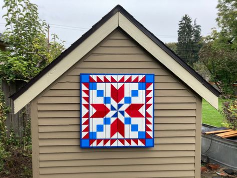 "Red White & Blue Barn Quilt hand painted on Western Red Cedar Pallet. All my Barn Quilts are painted on new, #1 quality Western Red Cedar ¾\" x 5 ¼\" fence boards.  Unlike plywood or MDO, cedar is insect and decay resistant, making them ideal for covered outdoor or indoor locations (not exposed to direct rainfall). The painted surfaces are sanded smooth, sealed, painted with premium acrylic paints, and finished with 3 coats of UV protected Clear Spar Urathane.  The pallet slats are secured with Blue Shed, Blue Barn, Painted Barn Quilts, Fence Boards, Barn Quilt Designs, Barn Art, Quilt Block Patterns Free, Barn Quilt Patterns, Patriotic Quilts