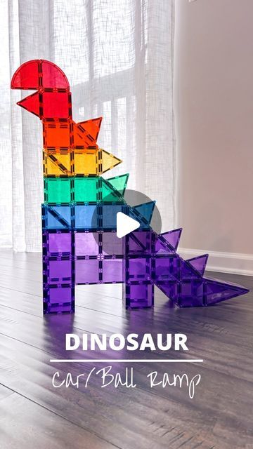 Alice | Open-ended Play | Magnetic Tiles on Instagram: "This build is “dino-mite” because it has two levels to race your balls/cars down. 

✨Follow and comment “DINO” for product information. 🦖

#stemtoys #stemforkids #magnetictiles #playbasedlearning #invitationtoplay #invitationtocreate #openendedtoys #playislearning #steameducation #earlylearning #educationaltoys  #learnandplay #playtolearn #educationalplay #simpleplayideas #pandamommyteacher #connetixballrun #connetixtiles #connetix #adultswhoconnetix #magnetictilescreations #magnetictileplayideas @connetix_tiles" Magnet Tile Dinosaurs, Picasso Tiles Marble Run, Magnetic Tile Dinosaur, Dinovember Crafts, Magnatile Dinosaur, Dinosaur Magnatiles, Picasso Tiles Building Ideas, Magnatile Builds, Magnetic Tiles Ideas For Kids