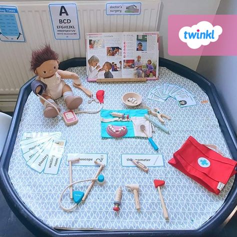 Chelsie’s doctors' tuff tray set up can be used to teach your children about the vital work of health care professionals, helping them to understand how much our health care heroes do for us, now more than ever. Recreate this engaging activity with our surgery role play pack - click to download and find thousands of teaching resources over on the Twinkl website. #doctors #nurses #healthcare #tufftray #tuffspot #twinkl #twinklresources #teachingresources #teacher #homeschooling #eyfs #earlyyears Doctors Surgery Role Play, Doctors Role Play Area, Doctor Tuff Tray Ideas, People Who Help Us Eyfs Activities Community Helpers, Occupations Eyfs Activities, People Who Help Us Eyfs Activities Doctors, Health And Self Care Activities Eyfs, Community Helpers Tuff Tray, Doctors Role Play