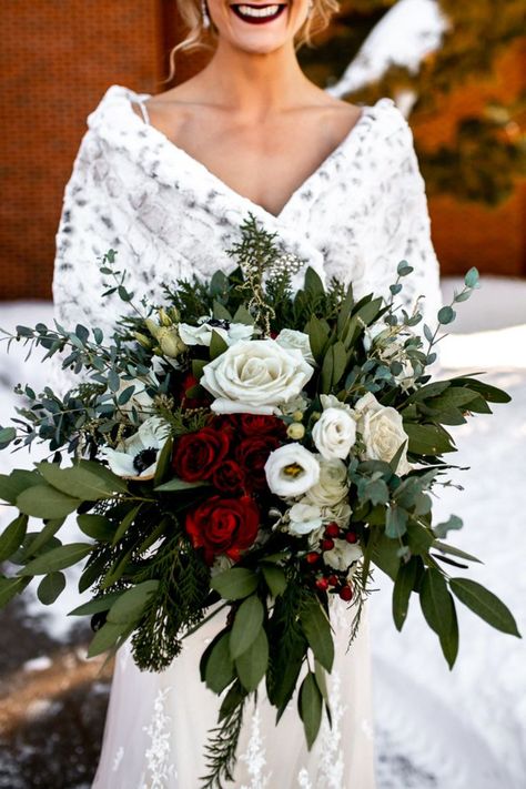 Stunning bridal floral bouquet with red and white roses and greenery. Winter Bouquet Aesthetic, Winter Rose Bouquet, Bridal Bouquet Christmas Wedding, Berry Winter Wedding, December Wedding Bouquets Brides, December Bridal Bouquet, Christmas Wedding Picture Ideas, Wedding Bouquets Red And White, Winter Wedding Bouquet Ideas