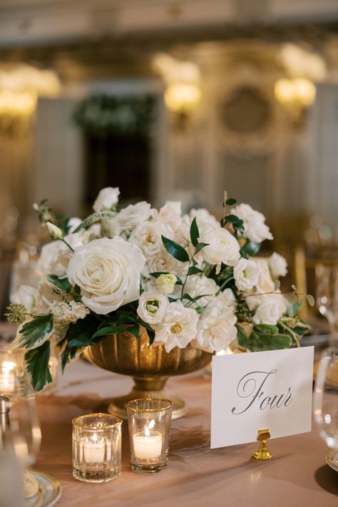 White floral centerpiece in gold compote • Classic and Romantic, Parisian-Inspired wedding at The Blackstone Hotel • Savoir Fête, Chicago Wedding Planner • Photography by Christy Tyler Silver Compote Centerpiece, Wedding Cocktail Table Centerpieces, Wedding Table Settings Romantic, Classic Wedding Floral Arrangements, Compote Wedding Centerpieces, Classic Elegant Wedding Centerpiece, White And Gold Floral Centerpieces, Soft Wedding Flowers, Classic Centerpieces Wedding