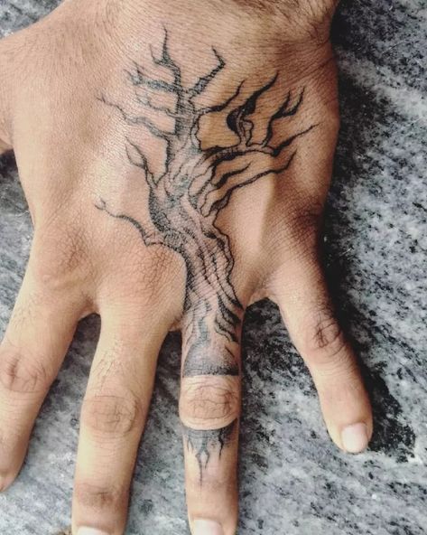 24 Tree Tattoo Ideas to Inspire Your Next Ink Design Poison Tree Hand Tattoo, Marvel Hand Tattoo, Hand Tattoos Nature, Poison Tree Tattoo Meaning, Tree Tattoo Hand, Tattoo Filler Ideas Men, Broken Tatoos Ideas, Traditional Tree Tattoo, Tree Finger Tattoo