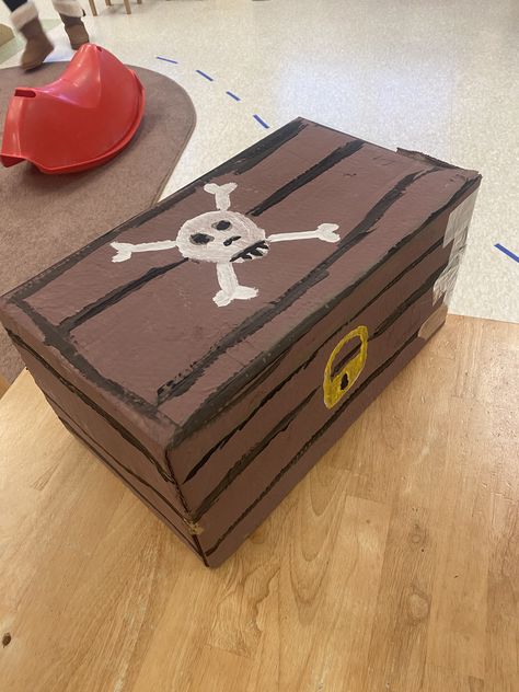 Cardboard box turned into treasure chest created by me Bookfair Themes, Diy Treasure Chest, Community Healing, Treasure Chest Craft, Pirate Theme Classroom, Chest Decor, Chests Diy, Peter Pan Party, Pirate Costumes