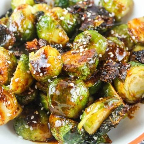 Longhorn Steakhouse has the most amazing Spicy Crispy Brussels Sprouts and I'm going to share with you an amazing copycat recipe that makes them EVEN BETTER at home! These are the best Brussels sprouts! They are so crispy and then they're tossed in sweet & spicy sauce you're going to want to pour on everything! Sweet And Spicy Brussel Sprout Recipes, Copycat Longhorn Brussel Sprouts, Longhorn Steakhouse Brussel Sprouts, Longhorn Brussel Sprouts Recipe, Longhorn Recipes, Longhorn Copycat Recipes, Longhorn Steakhouse Recipes, Brussel Sprout Recipe, Copycat Longhorn