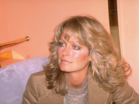 What goes around, comes around, and we're glad to see feathered hair is no exception. Ahead, 25 ways to wear feathery, '70s hair à la Farrah Fawcett. 1970s Hairstyles, Donna Mills, Feathered Hair, Ryan O'neal, Feathered Bangs, 70s Hair, Kate Jackson, Hair Icon, Farrah Fawcett