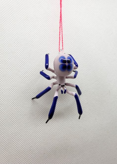 Beautiful model of a handmade Hanging Glass Spider figurine made of blown glass using the lampwork technique (also called glass blowing). Please pay attention at colors of the figurine- we used no paints or decal, only color glass. All shop: https://www.etsy.com/shop/OVGlassArtStudio Follow us: https://www.facebook.com/Aenpu/ https://www.instagram.com/ovglassart/ Ceramic Spider, Glass Blowing Art, Spider Glass, Glass Spider, Handmade Hanging, Blown Glass Art, Handmade Glass Beads, Glass Figurines, Glass Animals