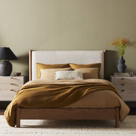 Rounded, chunky dowel legs in an amber oak finish frame the neutral, linen-like upholstered headboard of this bed frame. King Platform Bed, Classic Bed, Sanctuary Bedroom, Queen Platform Bed, Beds & Bed Frames, Four Hands, Bedroom Collection, Upholstered Platform Bed, Oak Veneer