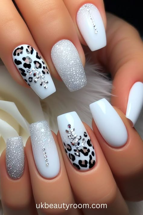 White nails are versatile, timeless, and suitable for any occasion. They offer a clean and polished look that complements any outfit. This post contains 39 white nail designs to help you stand out from the crowd. Cute, milk, milky, brown and, simple, short, gold and, gel, almond, coffin, square, with rhinestones, acrylic, with gems, with charms White Nails With Animal Print, Gel Nail Ideas Medium Length, Simple Sheek Nails, All White Acrylic Nails With Design, Simple One Finger Nail Design, Gel Polish Designs Ideas, Nails Gel X Designs, Nail Ideas Fancy, Acrylic Nails Gems Rhinestones