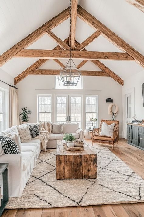 Enhance your home’s character with exposed wooden ceiling beams. Whether you’re going for a farmhouse look or a modern rustic vibe, wooden beams add depth and style. 🏠✨🌲 #WoodenBeams #CeilingDesign #HomeDecor #RusticCharm Spanish Farmhouse Living Room, New England Style Living Room, Wooden Ceiling Beams, Modern Farmhouse Living Room Design, Ceiling Beams Living Room, Farmhouse Lifestyle, Farmhouse Cozy, Farmhouse Living Rooms, Beams Living Room