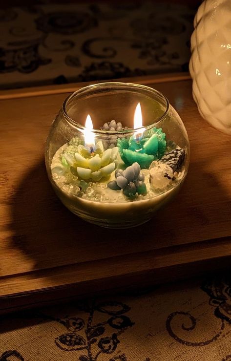 This hand poured two-wick  candle,is designed to bring a touch of nature into your home.  Each candle is customizable and crafted with  coco-soy wax and realistic beeswax succulents.   This candle makes for a beautiful botanical decor item or centerpiece. Each candle is unique so there may be variations in colors and arrangement.  These can be made to order with custom colors, scent options, and added crystals. Feel free to message me to discuss options! All candle fragrances are phthalate-free and adhere to the strict safety and purity standards established by the RIFM and IFRA. You can enjoy these calming or uplifting scents knowing that they are free from harmful chemicals and they meet the highest safety standards. Scented Candles Design, Candle Terrarium, Nature Candles, Succulent Candle Centerpiece, Succulent Candles, Terrarium Candle, Terrarium Succulent, Agave Cactus, Botanical Candle