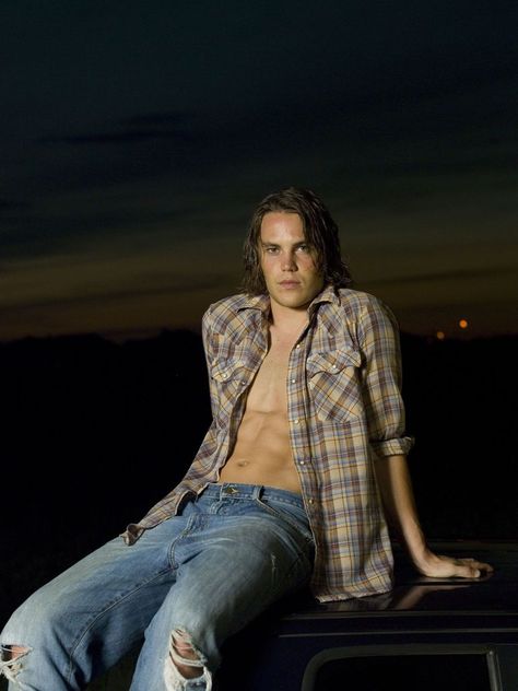 FRIDAY NIGHT LIGHTS -- Season 1 -- Pictured: Taylor Kitsch as Tim Riggins -- Photo by: Virginia Sherwood/NBC/NBCU Photo Bank Tim Riggins Friday Night Lights, Riggins Friday Night Lights, Tim Riggins, Jesse Metcalfe, Avan Jogia, Photo Bank, Ryan Guzman, Taylor Kitsch, Karl Urban