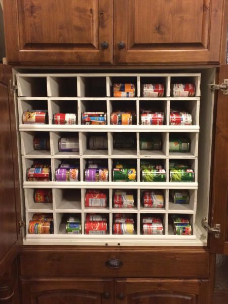 can-food-rotation-system-diy Food Storage Cabinet Ideas, Can Organization In Pantry Diy, Diy Can Storage, Soup Can Organization Diy, Fifo Can Storage, Can Dispenser Diy, Pantry Can Storage, Pop Can Storage, Stackable Can Organizer