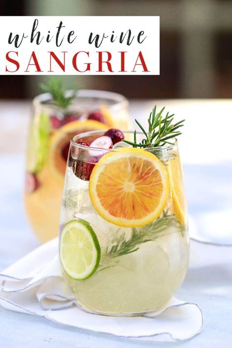 white sangria recipe: The best easy white wine sangria with orange (for winter) or peach (for summer). This winter sangria is perfect for Christmas and such a delicious Spanish cocktail recipe! #wine #sangria #cocktails Dry White Wine Sangria, Homemade Sangria White Wine, White Wine Sangria Recipe Fall, Fall White Sangria Recipe, Winter White Wine Sangria, White Winter Sangria Recipes, Winter White Sangria Recipe, Easy Wine Cocktails, Fall White Wine Sangria