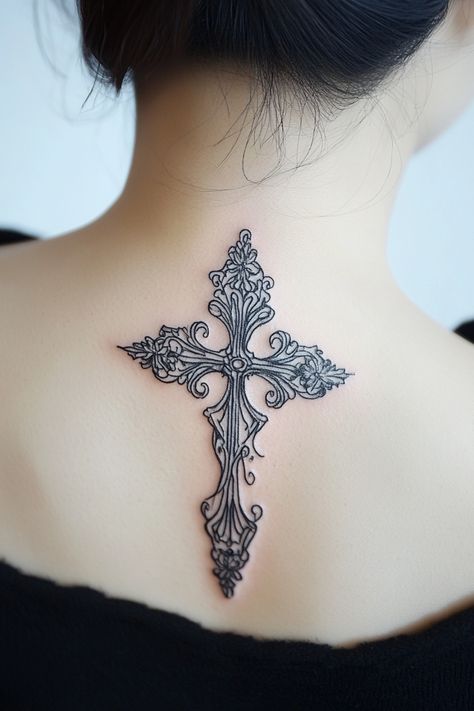 Ornate cross tattoo on the upper back of a person with short hair. Cross Tatoos Woman Arm, Unique Cross Tattoos For Women Beautiful, Cross Tatoos Woman, Celtic Cross Drawing, Tattoo Crosses, Catholic Tattoos For Women, Biblical Tattoos For Women Sleeve, Gothic Cross Tattoo, Pretty Cross Tattoo