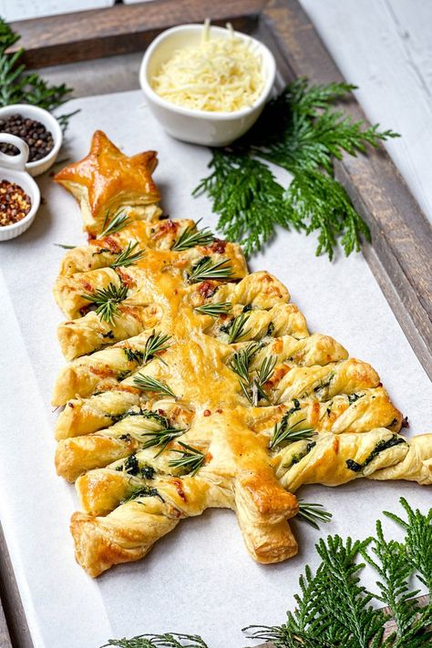 It's the festive season and this Spinach Puff Pastry Christmas Tree is savory treat you, your family, and guests will love. Simple to make with a cheesy spinach filling, store-bought puff pastry and pizza sauce for serving. Spinach Puff Pastry Christmas Tree, Spinach Christmas Tree Appetizer, Savoury Christmas Treats, Puff Pastry Recipes Christmas, Christmas Savory Snacks, Savory Christmas Treats, Puff Pastry Tree, Christmas Puff Pastry, Christmas Tree Pastry