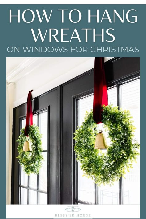 A step-by-step video tutorial to learn how to hang Christmas wreaths on windows + how to add ribbon and bells for an elegant festive look. Wreath In Stairwell, Christmas Wreath Ideas For Outside Windows, Christmas Outdoor Wreaths Window, Hanging Wreaths On Double Doors, Wreath Hanging From Ribbon In Window, Christmas Wreaths For Windows Outside, Wreaths On All Windows, Wreaths On Inside Windows, Vent Hood Wreath