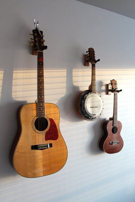 If I played/had a stringed instrument these are stylish wall mounts. And a good deal too: 3 for $24 Hang Guitar On Wall, Ukulele Wall Mount, Hanging Guitars, Future Decor, Guitar Display, Swivel Tv Stand, Guitar Room, Not Musik, Guitar Wall