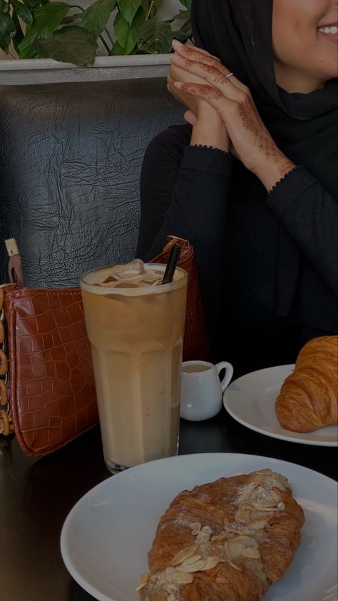 Girl sitting at coffee shop with iced latte and croissant Coffee Date Asethics, Coffee Date Pics, Coffee Date Snap, Sitting At Coffee Shop, Bestie Aesthetics, Coffee Date Aesthetic, Emily Core, Coffee Date With Friends, Coffee Dates Aesthetic