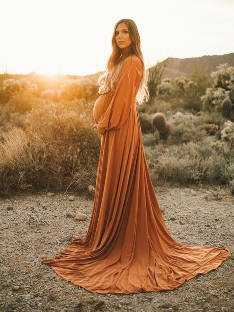 Etsy dress was a huge success for this beautiful desert maternity photo Terracotta Maternity Dress, Rust Dress Maternity Shoot, Maturity Dresses For Pictures, Maternity Photos Long Dress, Maternity Pictures Dresses, Native Maternity Photoshoot, Long Sleeve Maternity Dress Photo Shoot, Fall Maternity Dress Photo Shoot, Maternity Pictures In Desert