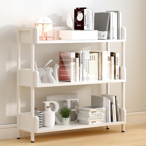 PRICES MAY VARY. MODERN STYLE - This 3-tier bookshelf with baffles is a unique furniture piece that immediately catches attention. With its modern appearance, the bookcase would make a great addition to any contemporary home; EDGE PROTECTION - Each shelf is designed with three sides of 12cm height panels, no need to worry about books falling over, keep books upright and neat at all times, no need to use extra bookends. It also prevents items from slipping off; MULTI-PURPOSE - The wide open shelf Open Shelf Bookcase, Display Bookshelf, Bookcase Modern, Standing Display, White Bookshelves, Open Bookshelves, Storage Shelving, Bathroom Storage Racks, Unique Furniture Pieces