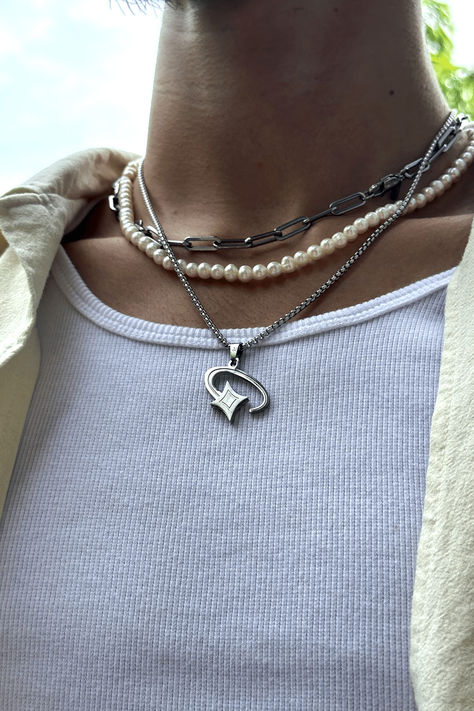 Picture of a silver shooting star pendant necklace for men. A unique cosmic jewelry piece made from stainless steel designed for streetwear fashion. It highlights a man's sense of style and individuality, perfect for a modern man who wants to stand out in urban fashion. #shootingstar #streetwear #stainlesssteeljewelry #menaccessory #modernjewelry Guy Jewelry, Hamburger Press, Streetwear Jewelry, Burger Press, Mens Silver Jewelry, Star Box, Boys Jewelry, Hamburger Meat, Streetwear Accessories