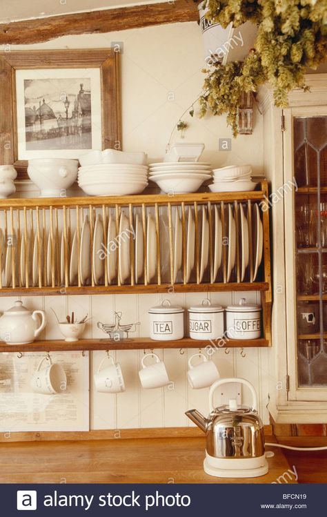 Download this stock image: Close-up of cream bowls and cups on wooden plate rack - BFCN19 from Alamy's library of millions of high resolution stock photos, illustrations and vectors. Plate Racks In Kitchen, Wooden Plate Rack, Primitive Kitchens, Kitchen Shelving, Dish Display, Cottage Decorating, Country Kitchens, Plate Rack, Casa Country