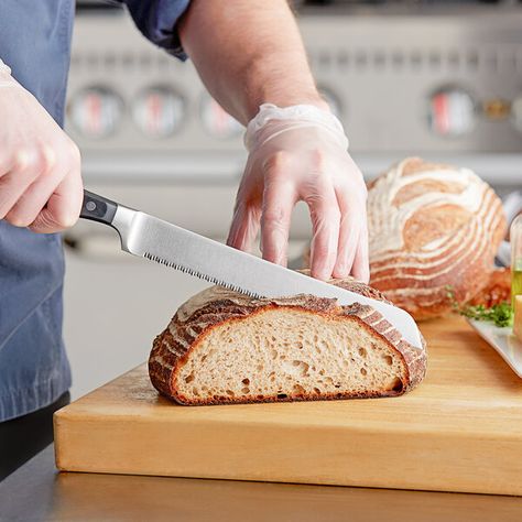 Give your kitchen an extra edge with this Wusthof 4152-7/23 Classic 9" forged double serrated bread knife with POM handle. This double serrated bread knife glides through crusty breads with minimal crumbs. Its careful design is perfect for use with more delicate foods, including angel food cake and produce. Wusthof's best-selling line for generations, the Classic collection features a wide range of premium, forged cutlery with POM handles to meet a kitchen's every need.   All Wusthof Classic cut Bread Soft, Blade Sharpening, Deli Meat, Angel Food Cake, Bread Knife, Food Cake, Paring Knife, Crusty Bread, Professional Chef