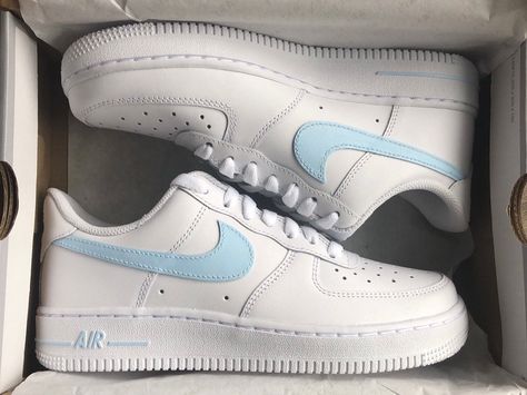 These custom hand painted Nike Air Force 1 sneakers feature a Light Blue color theme that helps you feel special! ★ Painted with acrylic leather paint and topped with a finished to ensure quality, durability, and long wear (waterproof, scratch proof, and dull-proof). ★ Sizes are in US. ★ These shoes are hand painted. ★ In the case that these shoes need to be washed, wetting a cloth and hand washing them is recommended, however they can be put in the wash set on delicate. Feel free to contact us for any questions you may have :) Check out our other products: https://www.etsy.com/shop/slatscustomsco Light Blue Air Force 1, Blue Air Force 1 Outfit, Cute Airforce 1, Nike Air Force 1 Painting Ideas, Airforce 1 Women, Nike Air Force Blue, Painted Nike Air Force, Blue Air Force 1, Nike Rosa