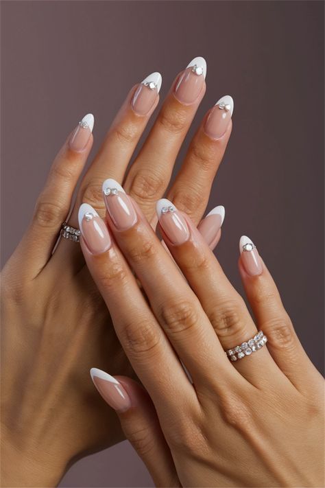 Elevate your manicure with these simple nail ideas featuring delicate rhinestones that add just the right amount of glam. Each nail shines effortlessly, making this look perfect for any occasion. Whether you opt for a single rhinestone accent or a sprinkle of them across your nails, this style can transform your everyday look into something truly special. Explore this elegant twist on simplicity! Nail Ideas With Rhinestones, Bright Nail Ideas, Simple Nail Ideas, Vibrant Nail Designs, Vibrant Nails, Bright Nails, Simple Nail, Simple Nails, Nail Ideas