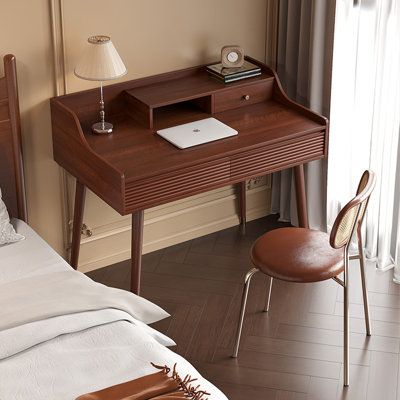 This stylish desk with a chair included, boasting three drawers, is perfect for any home office. Get comfortable and enjoy the luxurious feel of the upholstered chair as you focus on your tasks. Size: 36.02" H x 31.5" W x 23.62" D | Corrigan Studio® 31.5" Manufactured Wood desks 36.02 H x 31.5 W x 23.62 D in Wood in Brown | 36.02" H x 31.5" W x 23.62" D | Wayfair Reading Table Design, Desk Table Design, Dark Wooden Desk, Mid Century Mini Desk, Walnut Interior, Dark Wood Desk, Cherry Wood Desk, Chairs Desk, Type Writing