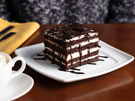 Olive Garden’s 'Chocolate Brownie Lasagna' Isn’t Really a Lasagna, but Why Quibble? | The limited-time-only, eight-layer dessert doesn't actually contain any pasta. Chocolate Brownie Lasagna Olive Garden, Olive Garden Brownie Lasagna Recipe, Copycat Olive Garden Chocolate Lasagna, Olive Garden Dessert Recipes, Olive Garden Chocolate Lasagna Recipe, Brownie Lasagna Dessert, Chocolate Lasagna Olive Garden, Chocolate Brownie Lasagna, Olive Garden Desserts