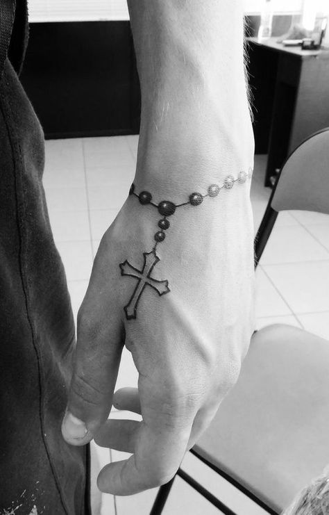 Unique Men’s Wrist Tattoos: Ideas for Personal Style and Expression Cr7 Tattoo, Cross Tattoo On Hand, Cruces Tattoo, Tato Salib, Wrist Bracelet Tattoo, Simple Wrist Tattoos, Unique Wrist Tattoos, Simple Tattoos For Guys, Cool Wrist Tattoos