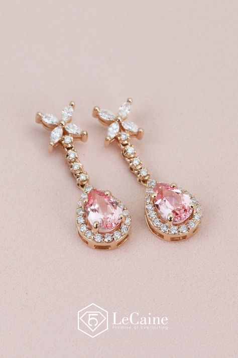 A pair of custom pear-shaped pink sapphire earrings, elegantly framed by sparkling, conflict-free lab-grown diamonds. At the top featuring four marquise-cut stones arranged into a delicate flower. The soft blush of the pink sapphire, combined with the brilliance of colorless diamonds, creates a stunning blend of femininity and elegance. 🌸💎 Perfect for special occasions or elevating your everyday style! Pink Sapphire Earrings, Bespoke Jewellery, Sapphire Earrings, Dangling Earrings, Delicate Flower, Marquise Cut, Pear Cut, Pink Sapphire, Pear Shaped