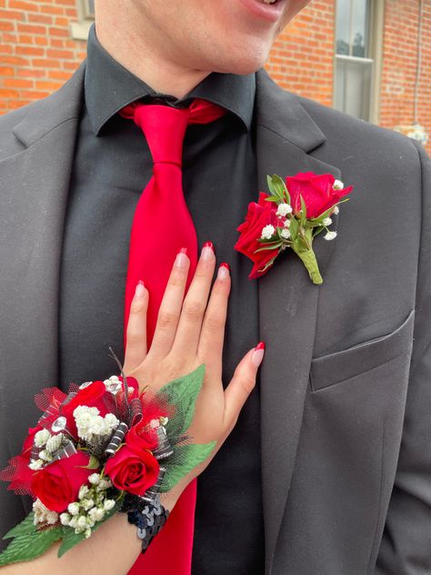 Red Tux Prom, Prom Corsage Red, Prom Looks For Guys, Red Prom Suit, Red Corsages, Prom Outfits For Guys, Black Corsage, Prom Corsage And Boutonniere, Boutonnieres Prom