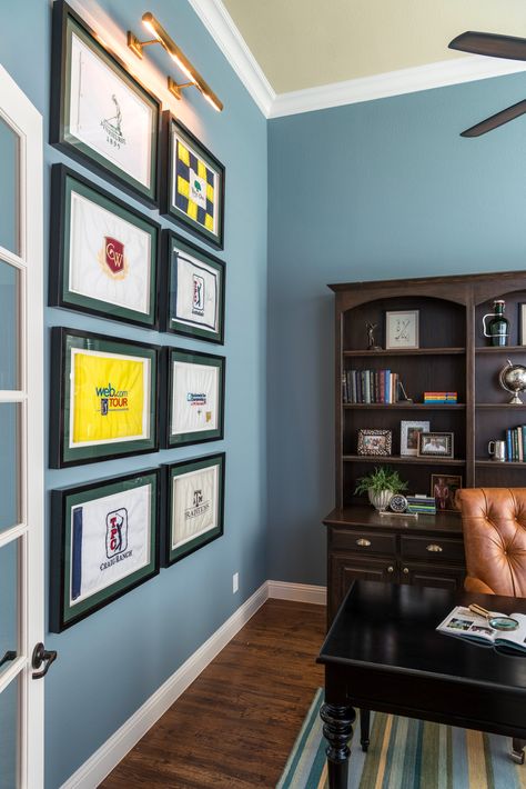 Golf Flag collection in Study by Nicole Arnold Interiors Golf Flags Display, Man Cave Golf Theme, Golf House Decor, Golf Club Display On Wall, Golf Memorabilia Display, Golf Display Ideas, Golf Office Decor Ideas, Golf Theme Office, Golf Decorating Ideas Interior Design