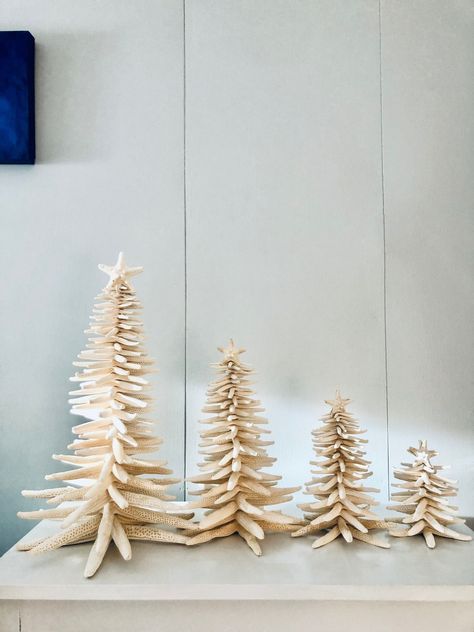 This Christmas tree is made of natural finger starfish.  It is a unique holiday decoration for the winter time. If you miss the beach in the winter this is something that will bring the beach to your home. Please select the tree size from the options added on the right of the picture.  Small - 5.5-6.5 inches tall Medium - 7.5 - 8.5 inches tall Large - 11.5 - 12.5 inches tall Extra Large 15.5 - 18 inches tall  All my trees are well packed for a safe transportation. Unfortunately I cannot accept returns on seasonal products. Seasonal products such as ornaments, wedding decor, Christmas trees and decors, Halloween and Thanksgiving decor. Coastal Xmas Tree, Beach Cottage Christmas Decor, Christmas Beach House, Coastal Winter Decor, Ocean Christmas Decor, Coastal Christmas Aesthetic, Coastal Holiday Decor, Coastal Halloween Decor, Beachy Fall Decor